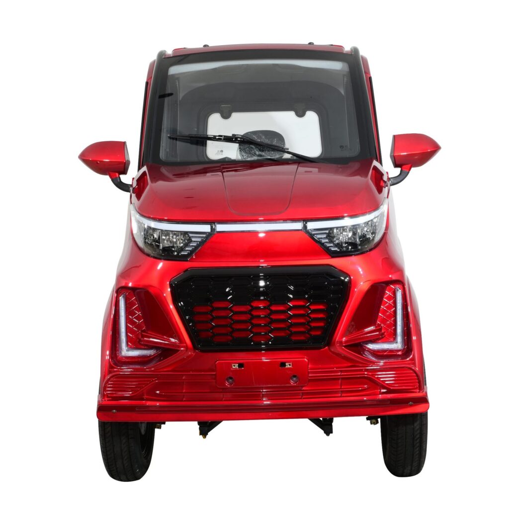 Front view of a vibrant red Green Transporter Q Express, showcasing its bold grille design and angular headlights, reflecting a dynamic and eco-friendly transportation choice.